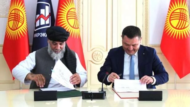 Delegations of Afghanistan and Kyrgyzstan during a formal meeting.