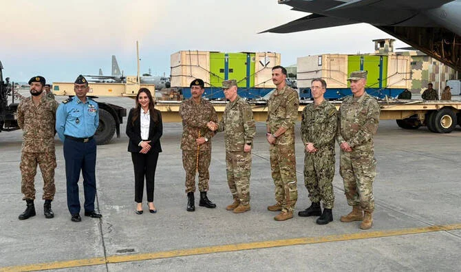 US Chargé d’Affaires Natalie Baker (third from left) joins officials for a group photo during the handover of emergency flood aid for Pakistan at Nur Khan Airbase, Rawalpindi. (@MohsinnaqviC42/X).