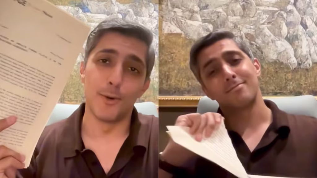 Ali Tareen tearing a legal notice from the Pakistan Cricket Board (PCB) in protest