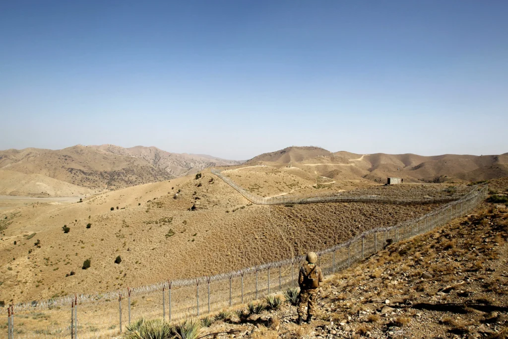 A Pakistani soldier stands guard near the border fence at the Kitton outpost in North Waziristan, overlooking Afghanistan, October 18, 2017. [Courtesy: Reuters].