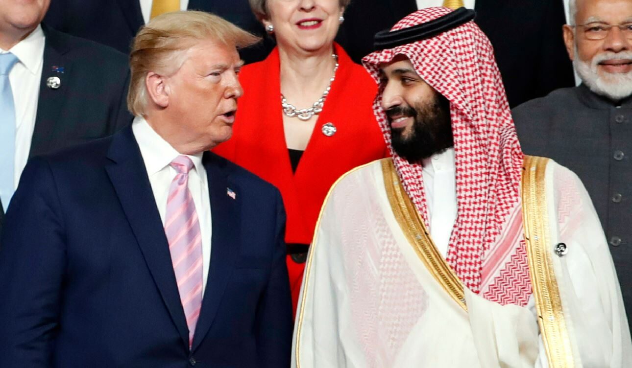 President Donald Trump, left, speaks with Saudi Arabia's Crown Prince Mohammed bin Salman during a family photo session at the G-20 leaders summit in Osaka, Japan, June 28, 2019.