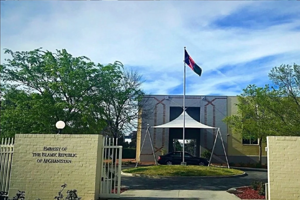 Australian flag with Afghan embassy in background