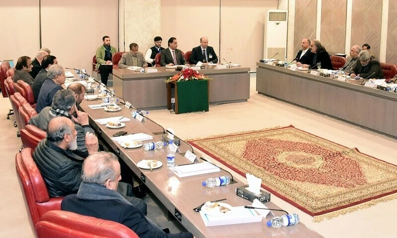 PTI parliamentary meeting discussing resignation decision and continued participation in National Assembly.