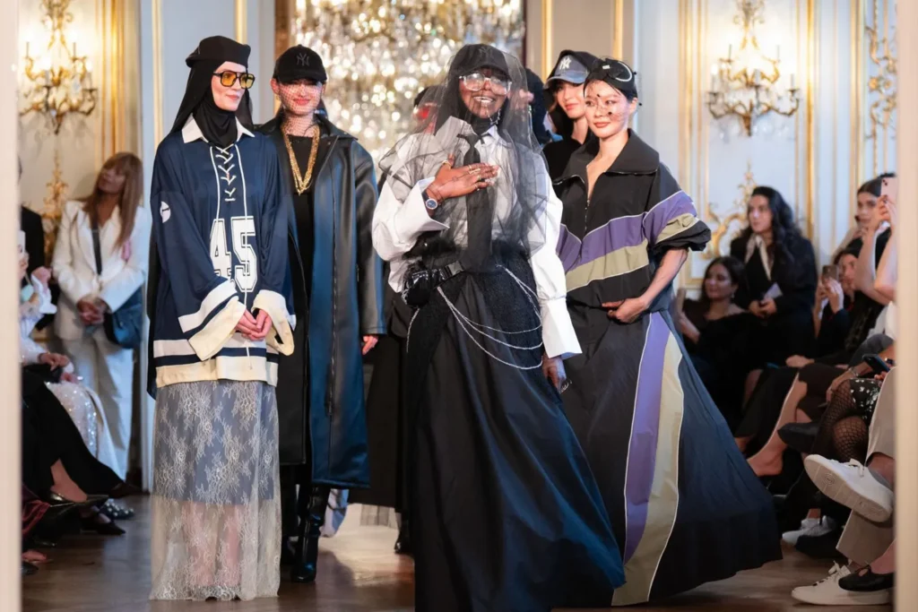 Models showcasing modest fashion designs with headscarves and modern streetwear on Paris runway