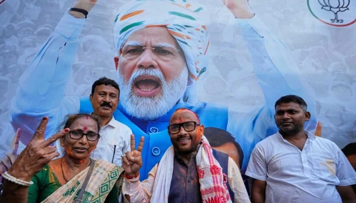 BJP supporters celebrating election victory in West Bengal amid concerns over voter list deletions and electoral fairness.